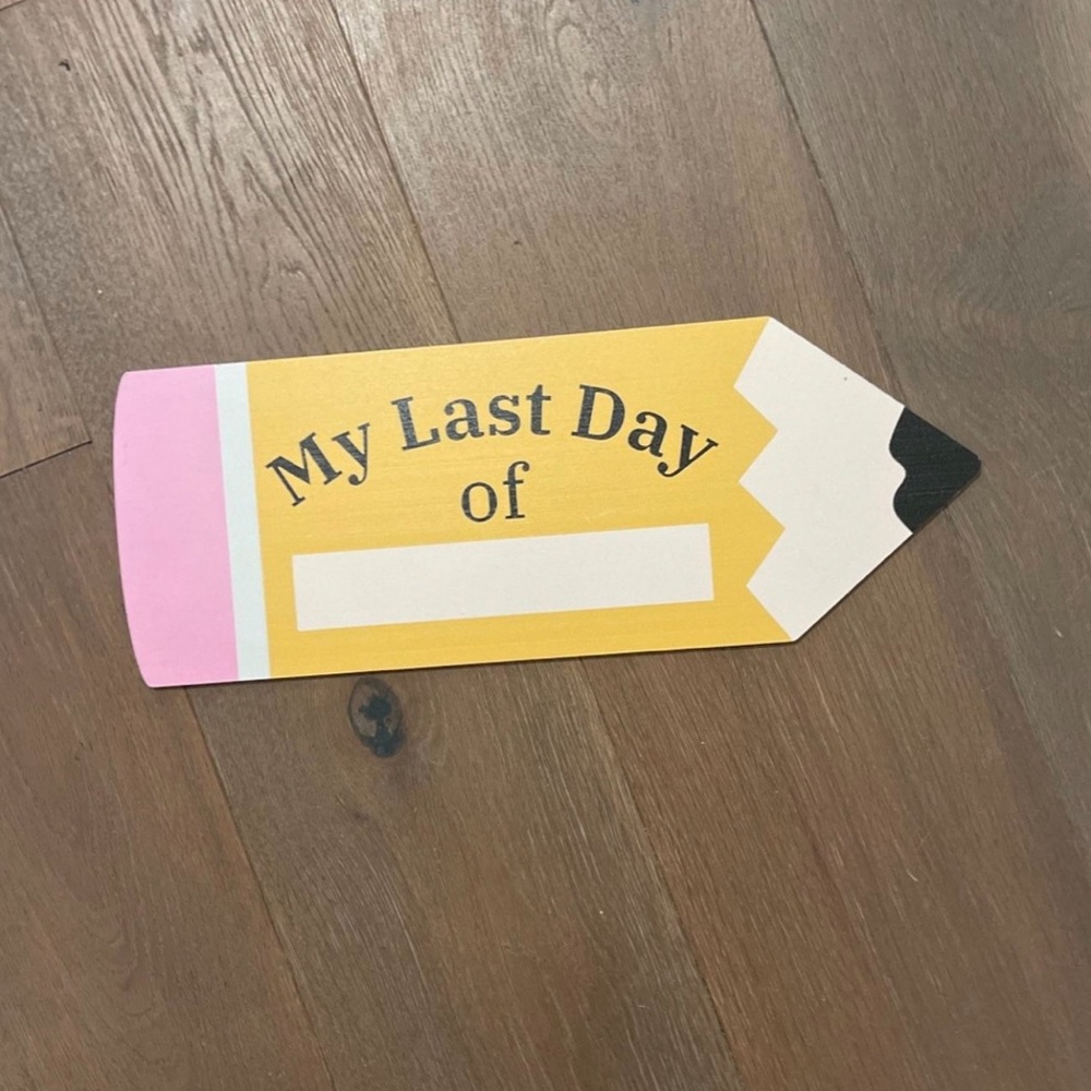 Yellow and Pink Pencil Sign